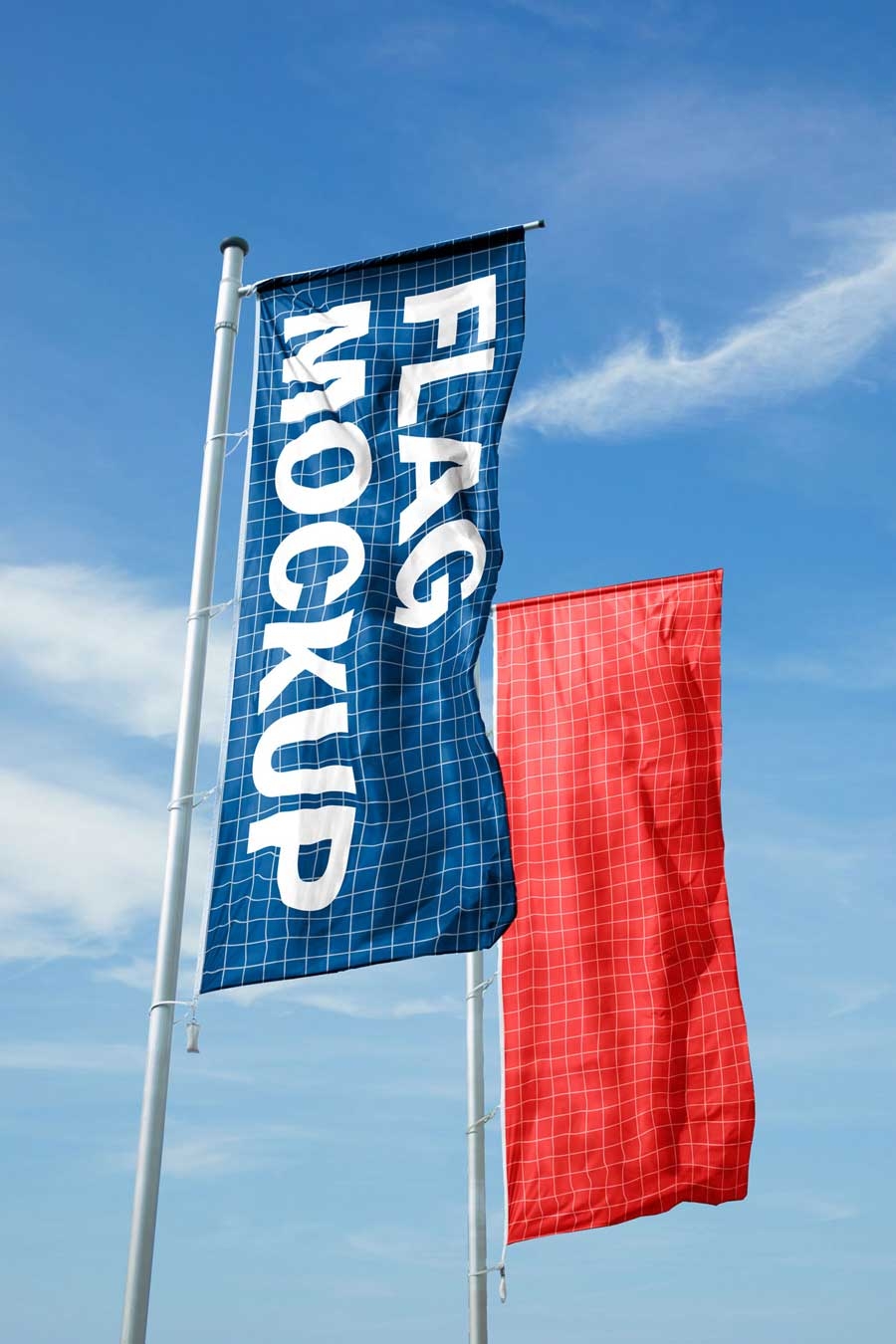 free flag mockup with two vertical flags in front of blue sky